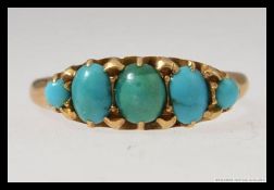 An early  ladies 18ct gold 5 stone turquoise ring being claw mounted.