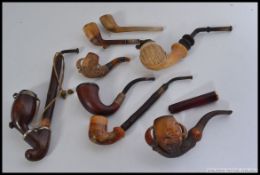 A collection of vintage pipes to include a stunning claw set Meerschaum pipe,  2 hunting pipes,