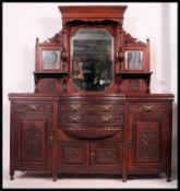 A Victorian mahogany bow front mirror back sideboard.