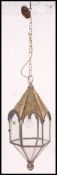 A very large brass external hanging light, glass panels divided by rope twist brass work.