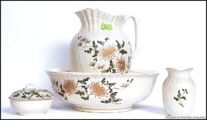 An early 20th century Staffordshire porcelain wash set comprising of jug, basin,