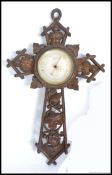 A good sized 19th century Victorian carved oak wall barometer set on carved crucifix - cross with