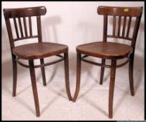 A pair of mid century Thonet style bentwood cafe chairs.