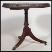 A good quality Regency revival mahogany and leather tripod wine table.