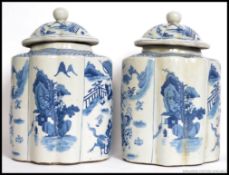 A large pair of Chinese Kang-xi style blue and white ginger - spice jars.