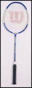 An oversized shop advertising Badminton racket / raquet by Wilson,