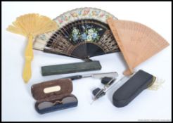A mixed lot of items to include 2x vintage cased cutthroat razors, 3x vintage hand fans,
