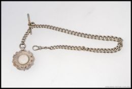 A silver hallmarked chunky pocket watch albert chain and bar with silver hallmarked armorial