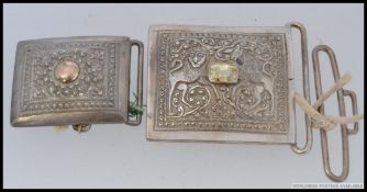 An Indian white metal (unmarked) buckle, likely silver.