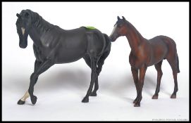 A BESWICK FIGURE OF A BLACK HORSE with white blaze and one white sock, matte finish,