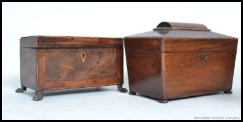 Two antique tea caddies - the first mounted on ball and claw brass feet,
