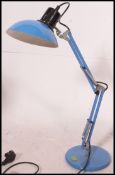 A retro desk lamp, anglepoise,