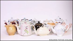 A large collection of teapots to include various shapes and patterns.