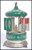 A vintage mid century enamel musical rotating cigarette dispenser,