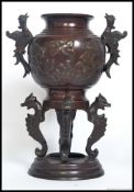 A 20th century Chinese oriental bronze urn, with rounded base.