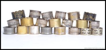 A collection of napkin rings to include white metal, possibly silver ( untested) brass,