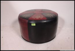 A retro mid century two tone vinyl panel stitched pouffe,
