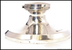 A hallmarked silver inkwell, hallmarked for AJP & Co.