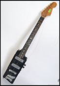 A vintage Bo Diddley style rectangular electric six string guitar,