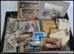 A collection  ( box ) of vintage postcards to include landscape, seascape etc.
