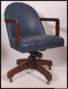 A 1950's mid century oak office swivel chair by Hillcrest.