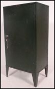 A retro mid century Industrial metal office filing cabinet in British military green original paint
