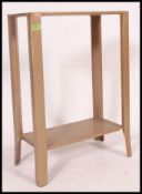 A mid 20th century industrial vintage gilt painted iron, two tier tote tray.