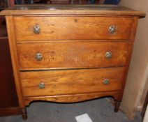 A 1930's oak chest of drawers together with an Arts & Crafts style oak side cabinet and a 1930's