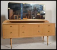 A retro 1970's light wood dressing table chest of drawers.