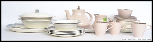 A part Poole dinner service along with a part Midwinter Stylecraft service