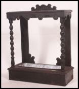A Victorian Jacobean revival oak stick stand having twin drawers with carved frame and gallery back.