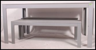 A large modern Ikea garden table together with 2 benches in the IKEA Falster range.