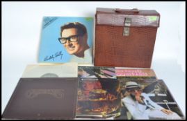 A collection of 27 Lp's / records to include Beatles albums x 2 set in a faux skin record case.