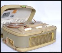 A vintage cased reel to reel cassette player recorder,