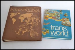 A collection of mid 20th century and later stamps from around the world contained in two albums