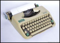 A retro cased 1960's / 1970's Olympia Splendid 35 typewriter,