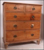 A Victorian pine country 2 over 3 large chest of drawers raised on bun feet with 2 short drawers