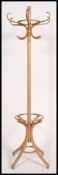 A Thonet style contemporary bentwood hat stand with hooks atop and shaped splayed base legs