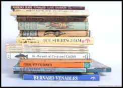 A collection of fishing reference books to include a signed copy of Bernard Venebles,
