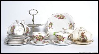 A vintage Chintz pattern Staffordshire tea service comprising cups, saucers plates etc.