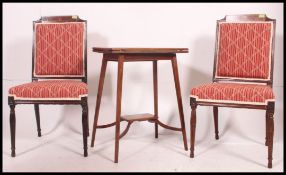 An Edwardian mahogany inlaid games / card table raised on squared legs with flip top.