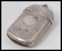 A hallmarked silver vesta case, with hallmarks for GI, Birmingham.