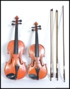 A student violin and another,