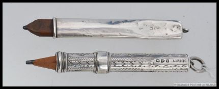 A hallmarked silver pencil / pen holder having rococo chased cylindrical body, chester hallmarks.