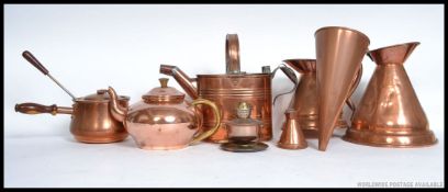 A collection of copper wares to include Victorian Hot Water Can, teapots,
