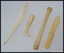 An early 20th century Chinese ivory cheroot with scrimshaw decoration together with Ivory letter