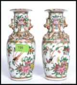 A pair of 19th century Chinese Canton vases of small form.