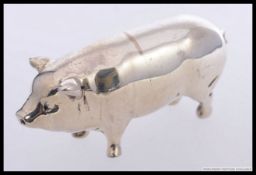 A silver hallmarked large pig figurine.