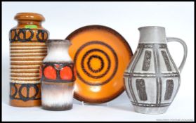 A collection of retro West German pottery to include vases and a Fat Lave drip glaze fruit bowl.