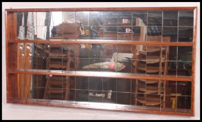 An unusual retro mirror back wall shelf bookcase cabinet.